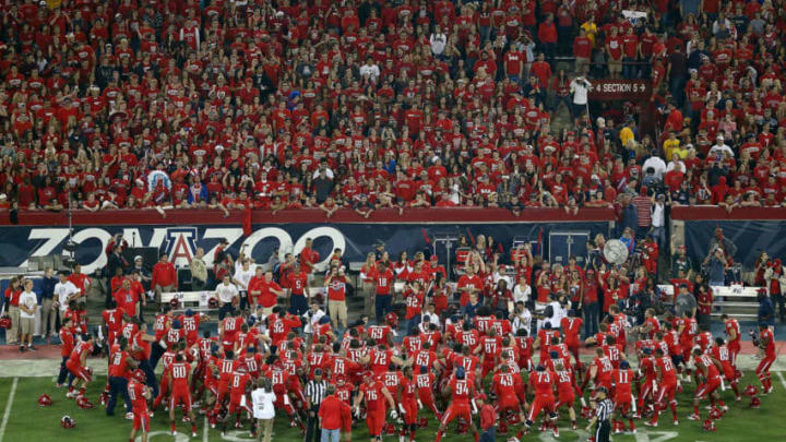 TUCSON, AZ - NOVEMBER 23: The Arizona Wildcats huddle up before the college football game against the Arizona State Sun Devils at Arizona Stadium on November 23, 2012 in Tucson, Arizona. The Sun Devils defeated the Wildcats 41-34. (Photo by Christian Petersen/Getty Images)