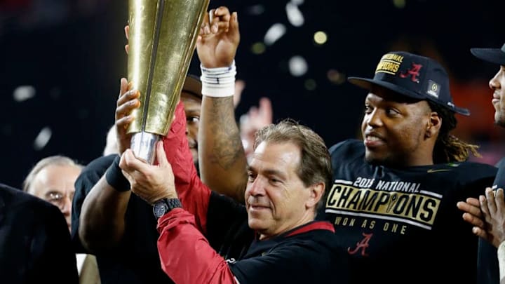 GLENDALE, AZ - JANUARY 11: Head coach Nick Saban of the Alabama Crimson Tide celebrates by hoisting the College Football Playoff National Championship Trophy after defeating the Clemson Tigers in the 2016 College Football Playoff National Championship Game at University of Phoenix Stadium on January 11, 2016 in Glendale, Arizona. The Crimson Tide defeated the Tigers with a score of 45 to 40. (Photo by Sean M. Haffey/Getty Images)
