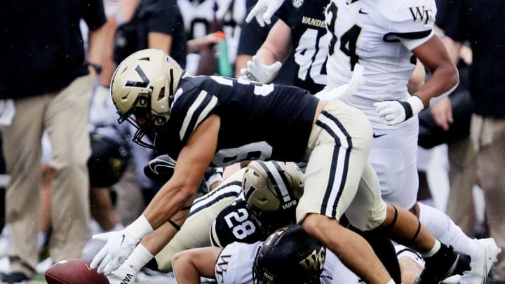 Cooper Lutz of Vanderbilt recovers a fumble during their game against Wake Forest at Vanderbilt’s FirstBank Stadium Sep 10, 2022; Nashville, Tennessee, United States; Mandatory Credit: Alan Poizner-The TennesseanFootball Vanderbilt Football Vs Wake Forest Wake Forest At Vanderbilt