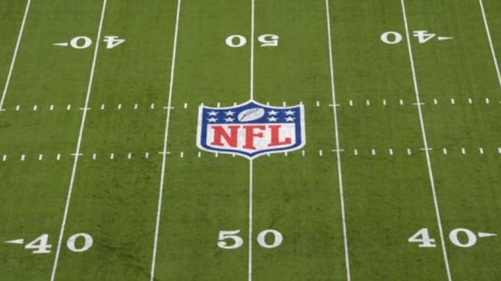 Nov 10, 2013; East Rutherford, NJ, USA; General view of the NFL shield logo at midfield at MetLife Stadium. Mandatory Credit: Kirby Lee-USA TODAY Sports