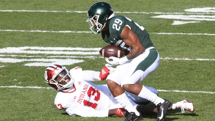 Nov 14, 2020; East Lansing, Michigan, USA; Michigan State Spartans cornerback Shakur Brown (29) intercepts a pass intended for Indiana Hoosiers wide receiver Miles Marshall (13) during the first quarter at Spartan Stadium. Mandatory Credit: Tim Fuller-USA TODAY Sports