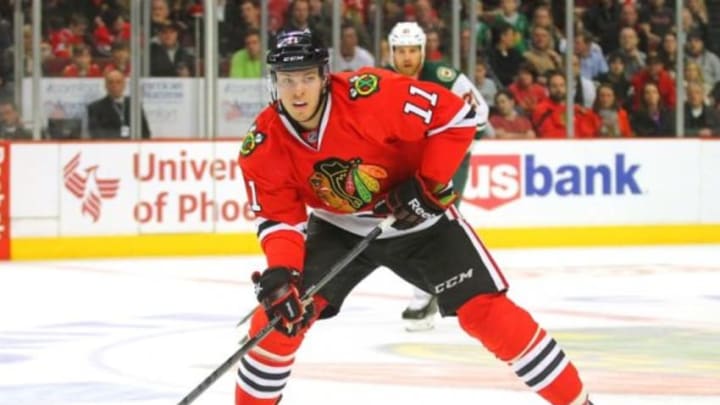 Apr 3, 2014; Chicago, IL, USA; Chicago Blackhawks left wing Jeremy Morin (11) skates with the puck during the second period against the Minnesota Wild at the United Center. Mandatory Credit: Dennis Wierzbicki-USA TODAY Sports