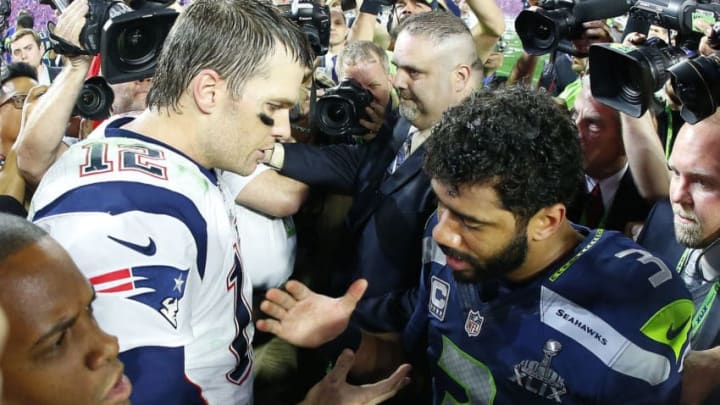 GLENDALE, AZ - FEBRUARY 01: Tom Brady #12 of the New England Patriots is congratulated by Russell Wilson #3 of the Seattle Seahawks after Super Bowl XLIX at University of Phoenix Stadium on February 1, 2015 in Glendale, Arizona. The Patriots defeated the Seahawks 28-24. (Photo by Tom Pennington/Getty Images)