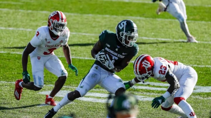 Michigan State wide receiver Jayden Reed is defended by Indiana defensive back Tiawan Mullen, left, and Indiana defensive back Jaylin Williams during the second half of MSU's 24-0 loss to Indiana at Spartan Stadium on Saturday, Nov. 14, 2020.