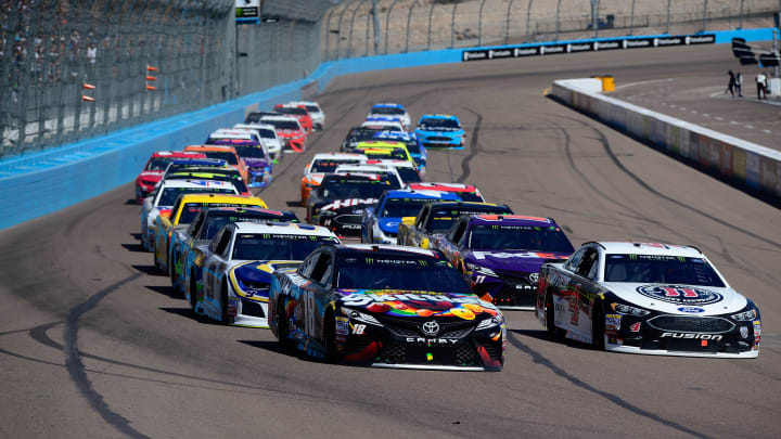 AVONDALE, AZ – MARCH 11: Kyle Busch, driver of the #18 Skittles Sweet Heat Toyota, and Kevin Harvick, driver of the #4 Jimmy John’s Ford (Photo by Robert Laberge/Getty Images)