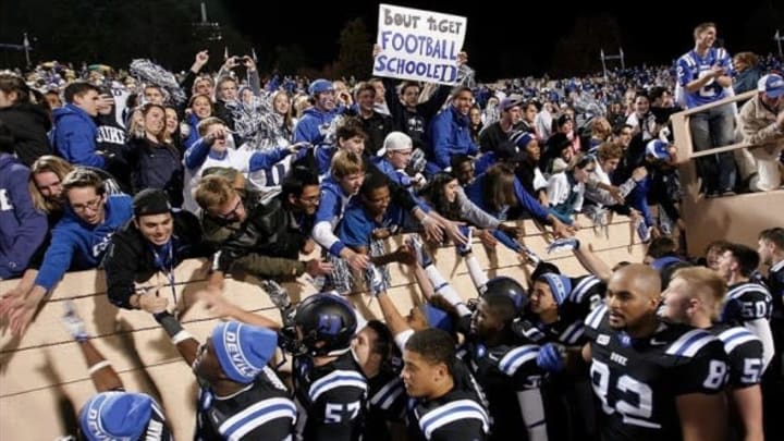 Nov 9, 2013; Durham, NC, USA; Duke Blue Devils fans celebrate with the team after beating the North Carolina State Wolfpack 38-20 at Wallace Wade Stadium. Mandatory Credit: Mark Dolejs-USA TODAY Sports