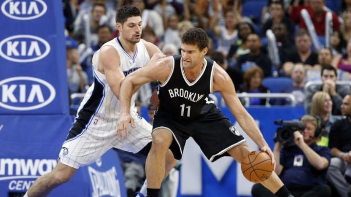 Dec 16, 2016; Orlando, FL, USA; Brooklyn Nets center Brook Lopez (11) drives to the basket as Orlando Magic center Nikola Vucevic (9) defends during the second quarter at Amway Center. Mandatory Credit: Kim Klement-USA TODAY Sports