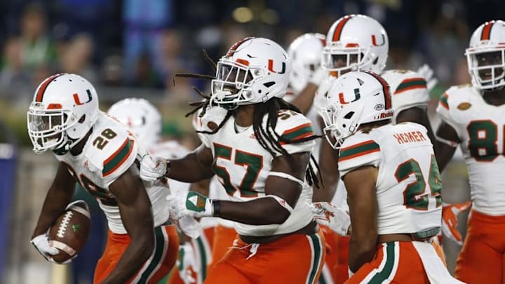 Oct 29, 2016; South Bend, IN, USA; Miami Hurricanes defensive back Michael Jackson (28) celebrates after recovering a fumble in the end zone for a touchdown against the Notre Dame Fighting Irish in the 4th quarter at Notre Dame Stadium. Notre Dame defeats Miami 30-27. Mandatory Credit: Brian Spurlock-USA TODAY Sports