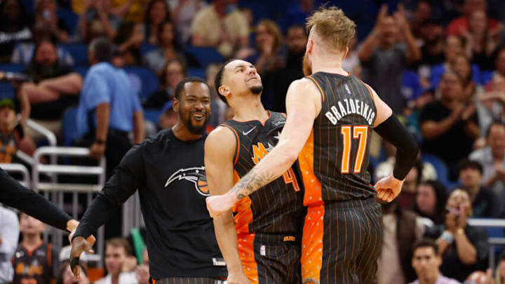 Apr 5, 2022; Orlando, Florida, USA; Orlando Magic guard Jalen Suggs (4) and Orlando Magic forward Ignas Brazdeikis (17) celebrate during a time out in the fourth quarter during a game against the Cleveland Cavaliers at Amway Center. Mandatory Credit: Nathan Ray Seebeck-USA TODAY Sports
