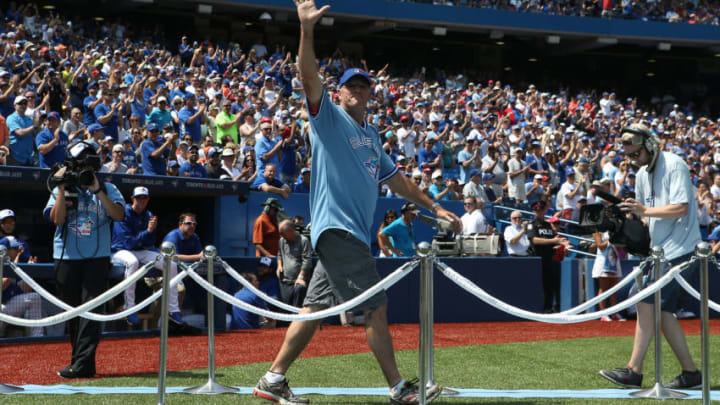 TORONTO, CANADA - AUGUST 16: Former player Tom Henke #50 of the Toronto Blue Jays acknowledges the fansâ ovation during a ceremony commemorating the 30th anniversary of the Blue Jaysâ first division title before the start of MLB game action against the New York Yankees on August 16, 2015 at Rogers Centre in Toronto, Ontario, Canada. (Photo by Tom Szczerbowski/Getty Images)