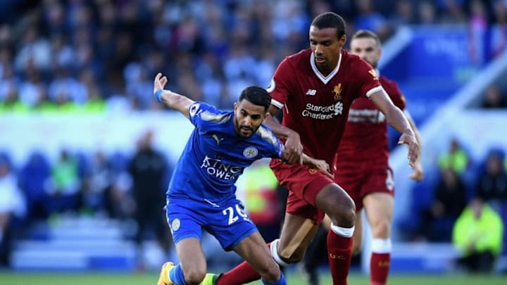LEICESTER, ENGLAND - SEPTEMBER 23: Joel Matip of Liverpool pulls back Riyad Mahrez of Leicester City during the Premier League match between Leicester City and Liverpool at The King Power Stadium on September 23, 2017 in Leicester, England. (Photo by Laurence Griffiths/Getty Images)