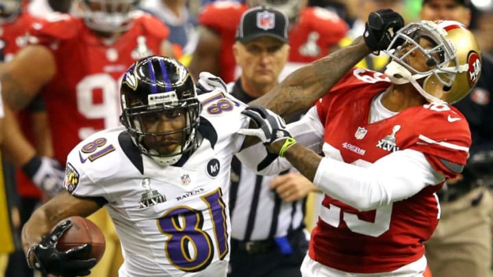 NEW ORLEANS, LA - FEBRUARY 03: Anquan Boldin #81 of the Baltimore Ravens runs with the ball and stiff arms Chris Culliver #29 of the San Francisco 49ers after catching a pass in the second half during Super Bowl XLVII at the Mercedes-Benz Superdome on February 3, 2013 in New Orleans, Louisiana. (Photo by Al Bello/Getty Images)