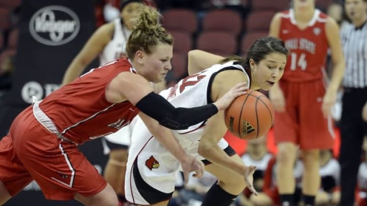 Nov 23, 2014; Louisville, KY, USA; Ball State Cardinals guard Jill Morrison (5) scrambles for the ball with Louisville Cardinals guard Jude Schimmel (22) during the second half at KFC Yum! Center. Louisville defeated Ball State 69-56. Mandatory Credit: Jamie Rhodes-USA TODAY Sports