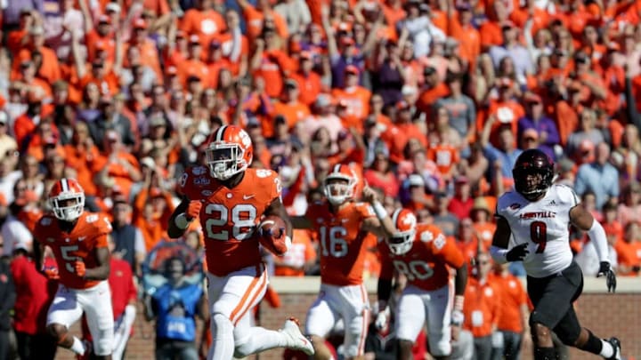 CLEMSON, SC - NOVEMBER 03: Tavien Feaster #28 of the Clemson Tigers runs for a touchdown against the Louisville Cardinals during their game at Clemson Memorial Stadium on November 3, 2018 in Clemson, South Carolina. (Photo by Streeter Lecka/Getty Images)