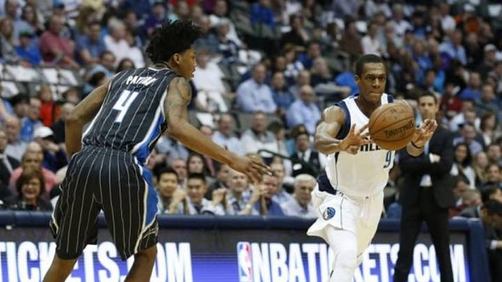 Mar 18, 2015; Dallas, TX, USA; Dallas Mavericks guard Rajon Rondo (9) passes the ball against Orlando Magic guard Elfrid Payton (4) at American Airlines Center. Mandatory Credit: Matthew Emmons-USA TODAY Sports