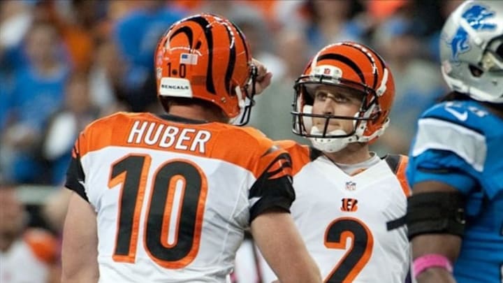 Oct 20, 2013; Detroit, MI, USA; Cincinnati Bengals kicker Mike Nugent (2) celebrates with punter Kevin Huber (10) after kicking the game winning field goal during the fourth quarter against the Detroit Lions at Ford Field. Bengals won 27-24. Mandatory Credit: Tim Fuller-USA TODAY Sports