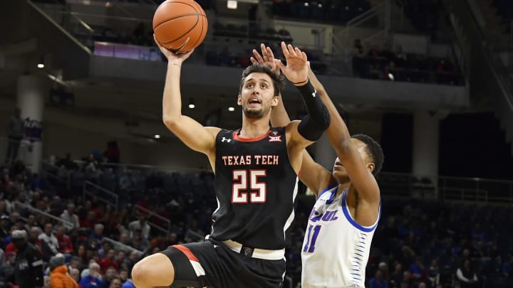 Davide Moretti #25 of the Texas Tech Red Raiders shoots a lay up in the first half against Charlie Moore #11 of the DePaul Blue Demons (Photo by Quinn Harris/Getty Images)