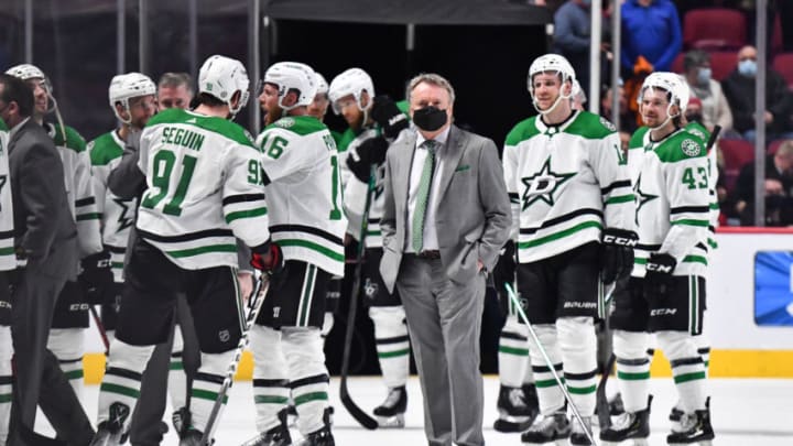 MONTREAL, QC - MARCH 17: Head coach of the Dallas Stars, Rick Bowness, looks on from the ice as his team celebrates an overtime victory against the Montreal Canadiens at Centre Bell on March 17, 2022 in Montreal, Canada. The Dallas Stars defeated the Montreal Canadiens 4-3 in overtime. (Photo by Minas Panagiotakis/Getty Images)