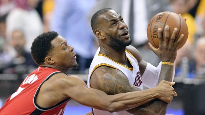 May 19, 2016; Cleveland, OH, USA; Toronto Raptors guard Kyle Lowry (7) fouls Cleveland Cavaliers forward LeBron James (23) during the second half in game two of the Eastern conference finals of the NBA Playoffs at Quicken Loans Arena. The Cavaliers won 108-89. Mandatory Credit: Ken Blaze-USA TODAY Sports