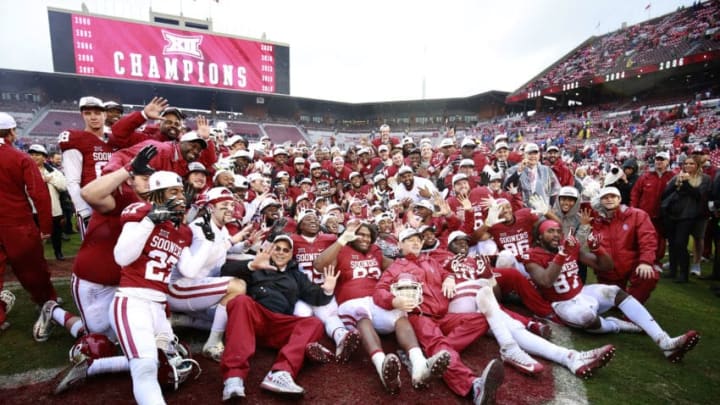 NORMAN, OK - DECEMBER 3: The Oklahoma Sooners pose for photos after the game against the Oklahoma State Cowboys December 3, 2016 at Gaylord Family-Oklahoma Memorial Stadium in Norman, Oklahoma. Oklahoma defeated Oklahoma State 38-20 to become Big XII champions. (Photo by Brett Deering/Getty Images)