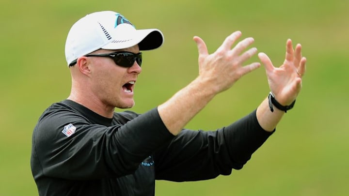 Carolina Panthers defensive coordinator Sean McDermott demonstrates how he wants the defense to lift up a loose ball during practice at Gibbs Stadium on the campus of Wofford College in Spartanburg, South Carolina, on Saturday, July 27, 2013. (Jeff Siner/Charlotte Observer/MCT via Getty Images)