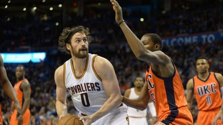 Feb 21, 2016; Oklahoma City, OK, USA; Cleveland Cavaliers forward Kevin Love (0) prepares to shoot the ball as Oklahoma City Thunder forward Kevin Durant (35) defends during the first quarter at Chesapeake Energy Arena. Mandatory Credit: Mark D. Smith-USA TODAY Sports