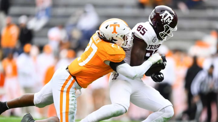 Dec 19, 2020; Knoxville, TN, USA; Tennessee linebacker Quavaris Crouch (27) tackles Texas A&M tight end Jalen Wydermyer (85) during a game between Tennessee and Texas A&M in Neyland Stadium in Knoxville, Saturday, Dec. 19, 2020. Mandatory Credit: Brianna Paciorka-USA TODAY NETWORK