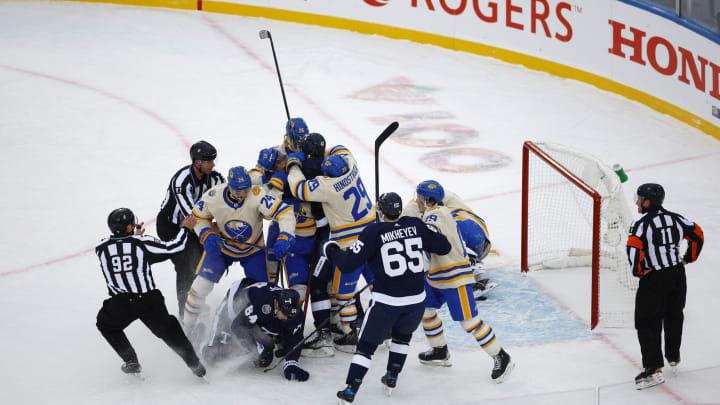 HAMILTON, ONTARIO – MARCH 13: Toronto Maple Leafs and Buffalo Sabres fight during the Heritage Classic at Tim Hortons Field on March 13, 2022 in Hamilton, Ontario. (Photo by Vaughn Ridley/Getty Images)