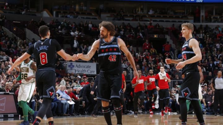 CHICAGO, IL - FEBRUARY 23: Robin Lopez #42 and Zach LaVine #8 of the Chicago Bulls high-five during a game against the Boston Celtics on February 23, 2019 at United Center in Chicago, Illinois. NOTE TO USER: User expressly acknowledges and agrees that, by downloading and or using this photograph, User is consenting to the terms and conditions of the Getty Images License Agreement. Mandatory Copyright Notice: Copyright 2019 NBAE (Photo by Jeff Haynes/NBAE via Getty Images)