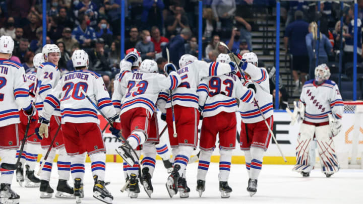 TAMPA, FL - DECEMBER 31: Mika Zibanejad #93 of the New York Rangers is congratulated after his game-winning shootout goal against the Tampa Bay Lightning at the Amalie Arena on December 31, 2021 in Tampa, Florida. (Photo by Mike Carlson/Getty Images)