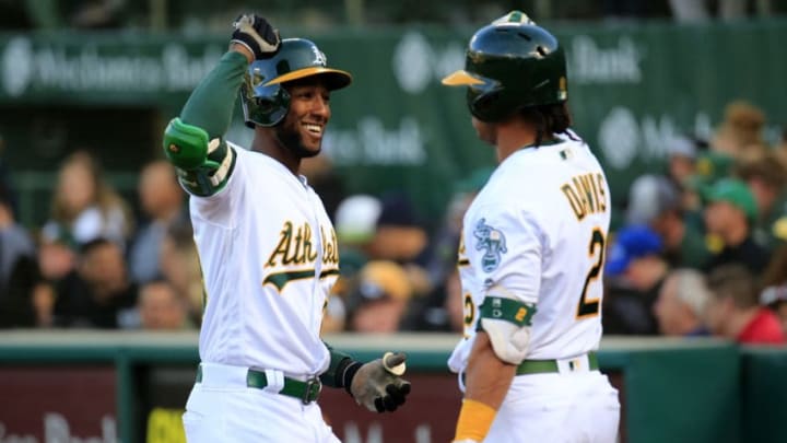 OAKLAND, CALIFORNIA - MAY 08: Jurickson Profar #23 of the Oakland Athletics celebrates a home run with Khris Davis #2 during the first inning against the Cincinnati Reds at Oakland-Alameda County Coliseum on May 08, 2019 in Oakland, California. (Photo by Daniel Shirey/Getty Images)