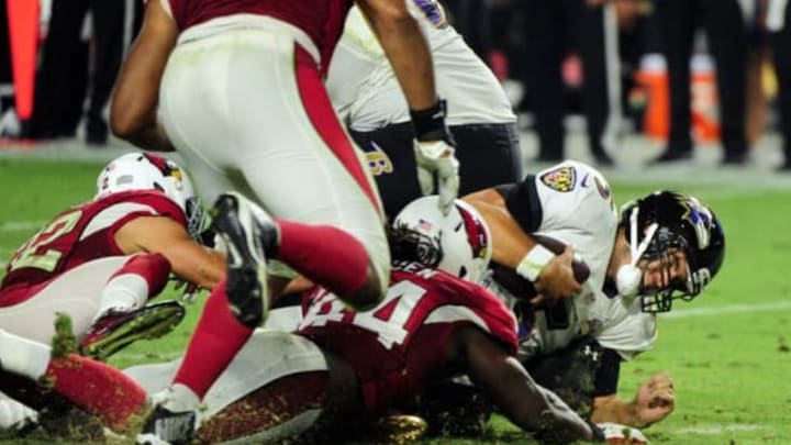 Oct 26, 2015; Glendale, AZ, USA; Baltimore Ravens quarterback Joe Flacco (5) is sacked by Arizona Cardinals free safety Tyrann Mathieu (32) during the second half at University of Phoenix Stadium. Mandatory Credit: Matt Kartozian-USA TODAY Sports