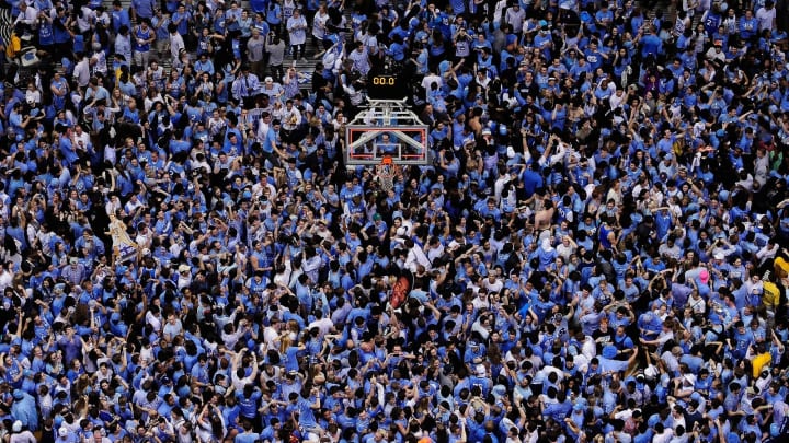 CHAPEL HILL, NC – FEBRUARY 20: North Carolina Tar Heels fans storm the court. (Photo by Grant Halverson/Getty Images)