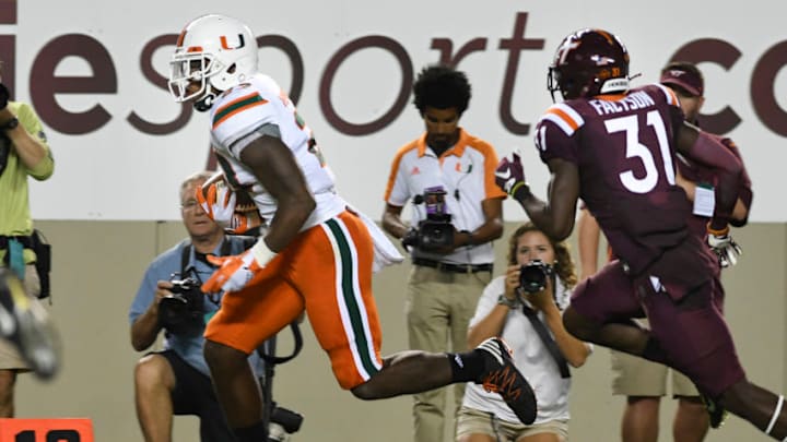 BLACKSBURG, VA - OCTOBER 20: Tight end Christopher Herndon IV #23 of the Miami Hurricanes rushes down the sideline to score a touchdown against the Virginia Tech Hokies in the second half at Lane Stadium on October 20, 2016 in Blacksburg, Virginia. Virginia Tech defeated Miami 37-16. (Photo by Michael Shroyer/Getty Images)