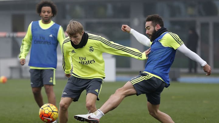 MADRID, SPAIN - DECEMBER 29: Martin Odegaard (L) and Daniel Carvajal of Real Madrid in action during a training session at Valdebebas training ground on December 29, 2015 in Madrid, Spain. (Photo by Angel Martinez/Real Madrid via Getty Images)