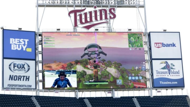 MINNEAPOLIS, MN - SEPTEMBER 9: Minnesota Twins pitcher Trevor May plays the video game Fortnite with the live game projected on the stadium screen before the Minnesota Twins play the Kansas City Royals in their baseball game on September 9, 2018, at Target Field in Minneapolis, Minnesota. (Photo by Andy King/Getty Images)