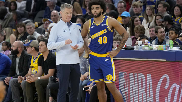 Head coach Steve Kerr of the Golden State Warriors stands and talks with Anthony Lamb during the third quarter against the Boston Celtics at Chase Center on December 10, 2022. (Photo by Thearon W. Henderson/Getty Images)