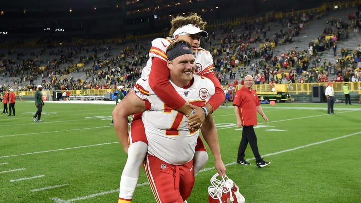 Patrick Mahomes #15 of the Kansas City Chiefs is escorted off the field on the back of Andrew Wylie #77 of the Kansas City Chiefs. (Photo by Quinn Harris/Getty Images)