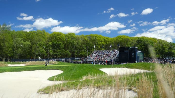 FARMINGDALE, NEW YORK - MAY 15: EDITORS NOTE: A POLARIZING FILTER WAS USED TO CAPTURE THIS IMAGE. Rory McIlroy of Northern Ireland walks on the 16th green during a practice round prior to the 2019 PGA Championship at the Bethpage Black course on May 15, 2019 in Farmingdale, New York. (Photo by Warren Little/Getty Images)