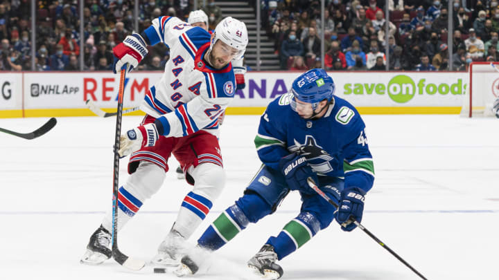 VANCOUVER, BC – NOVEMBER 2: Barclay Goodrow #21 of the New York Rangers tries to get around Quinn Hughes #43 of the Vancouver Canucks during the first period on November, 2, 2021 at Rogers Arena in Vancouver, British Columbia, Canada. (Photo by Rich Lam/Getty Images)