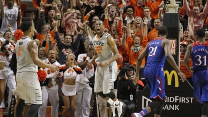 Mar 1, 2014; Stillwater, OK, USA; Oklahoma State Cowboys guard Markel Brown (22) celebrates scoring a basket during the second half against the Kansas Jayhawks at Gallagher-Iba Arena. Oklahoma State beat Kansas 72-65. Mandatory Credit: Tim Heitman-USA TODAY Sports