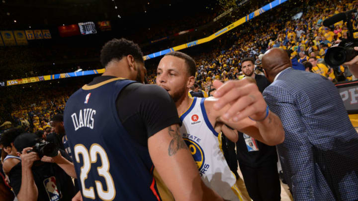 OAKLAND, CA - MAY 8: Stephen Curry #30 of the Golden State Warriors hugs Anthony Davis #23 of the New Orleans Pelicans after the game in Game Five of the Western Conference Semifinals during the 2018 NBA Playoffs on May 8, 2018 at ORACLE Arena in Oakland, California. NOTE TO USER: User expressly acknowledges and agrees that, by downloading and/or using this photograph, user is consenting to the terms and conditions of Getty Images License Agreement. Mandatory Copyright Notice: Copyright 2018 NBAE (Photo by Noah Graham/NBAE via Getty Images)