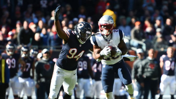 CHICAGO, IL - OCTOBER 21: James White #28 of the New England Patriots carries the football against Leonard Floyd #94 of the Chicago Bears in the third quarter at Soldier Field on October 21, 2018 in Chicago, Illinois. (Photo by Stacy Revere/Getty Images)