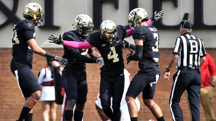 WINSTON SALEM, NC – OCTOBER 28: Defensive back Amari Henderson #4 of the Wake Forest Demon Deacons celebrates after breaking up a pass against the Louisville Cardinals during the football game at BB&T Field on October 28, 2017 in Winston Salem, North Carolina. (Photo by Mike Comer/Getty Images)