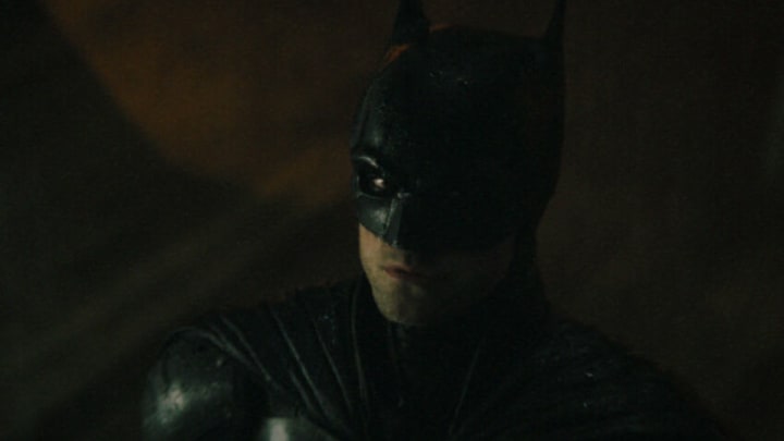 ROBERT PATTINSON as Batman in Warner Bros. Pictures’ action adventure “THE BATMAN,” a Warner Bros. Pictures release. Courtesy of Warner Bros. Pictures/ ™ & © DC Comics. Pictures release. © 2021 Warner Bros. Entertainment Inc. All Rights Reserved.