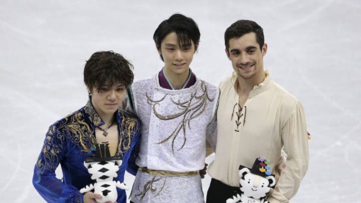 GANGNEUNG, SOUTH KOREA - FEBRUARY 17: Silver medalist Shoma Uno of Japan, gold medalist Yuzuru Hanyu of Japan, bronze medalist Javier Fernandez of Spain during the victory ceremony following the Figure Skating Men Free Program on day eight of the PyeongChang 2018 Winter Olympic Games at Gangneung Ice Arena on February 17, 2018 in Gangneung, South Korea. (Photo by Jean Catuffe/Getty Images)
