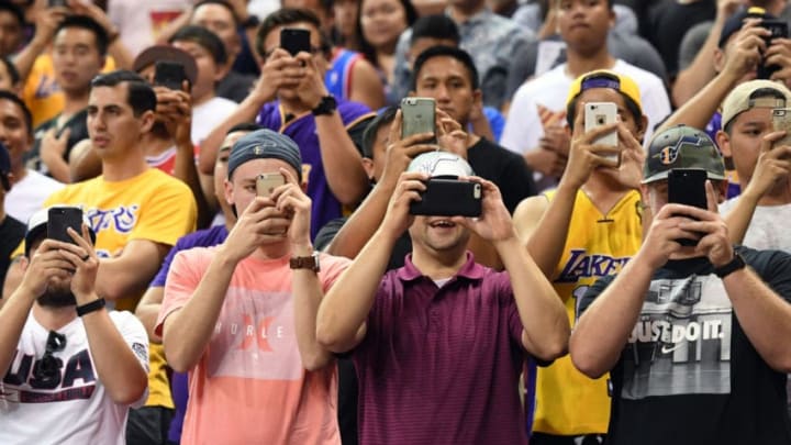 NBA fans take pictures on their phones (Photo by Ethan Miller/Getty Images)