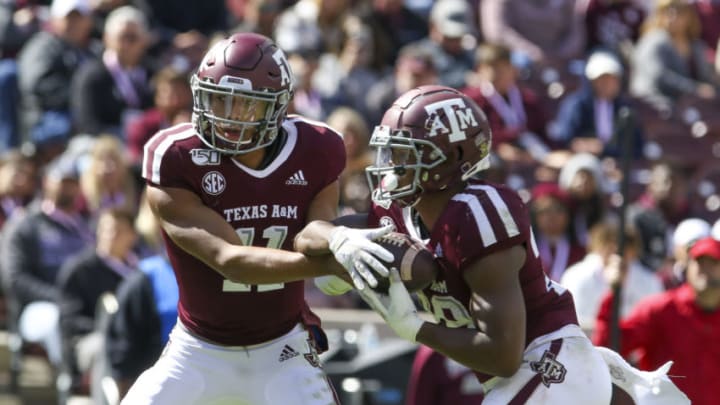 Oct 26, 2019; College Station, TX, USA; Texas A&M Aggies quarterback Kellen Mond (11) hands the ball off to Texas A&M Aggies running back Isaiah Spiller (28) during the third quarter against the Mississippi State Bulldogs at Kyle Field. Mandatory Credit: John Glaser-USA TODAY Sports