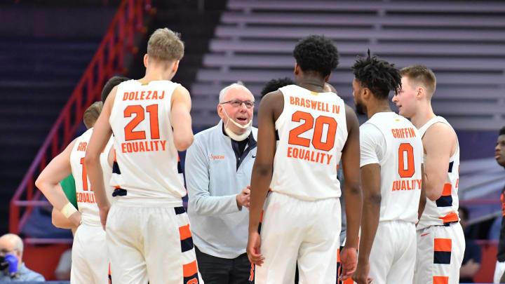Mar 1, 2021; Syracuse, New York, USA; Syracuse Orange head coach Jim Boeheim gives instruction to his team including forward Marek Dolezaj (21) and forward Robert Braswell (20) and forward Alan Griffin (0) in the second half against the North Carolina Tar Heels at the Carrier Dome. Mandatory Credit: Mark Konezny-USA TODAY Sports