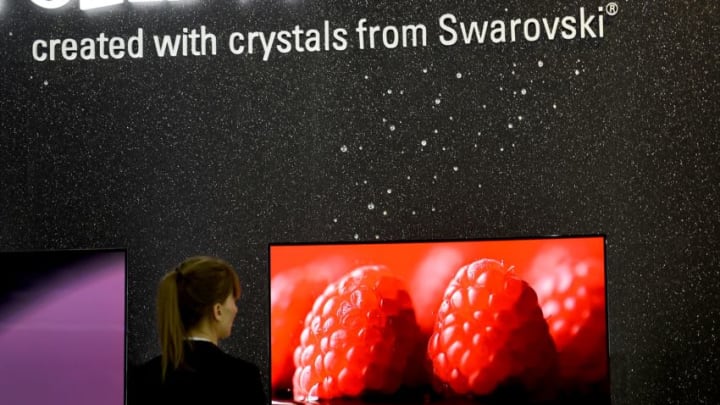 A woman looks at a OLED TV set modified with around 460 crystals from Swarovski at the booth of South Korea's electronics giant LG during the second press day of the consumer electronics trade fair 'Internationale Funk Ausstellung '(IFA) in Berlin September 4, 2014. IFA, one of Europe's biggest showcases of the latest electronic gadgets, is scheduled to open on September 5 and run until September 10, 2014. AFP PHOTO / TOBIAS SCHWARZ (Photo credit should read TOBIAS SCHWARZ/AFP/Getty Images)